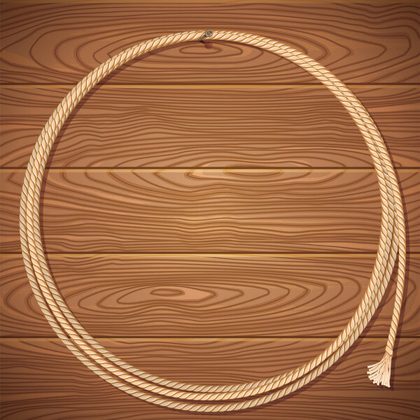 Канатный лассо на деревянном фоне

