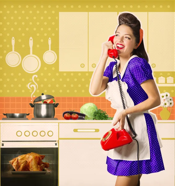 Retro woman talking on phone and cooks roasted chiicken on her l