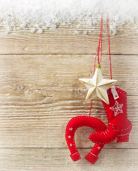 Cowboy christmas background with western toy boot and star on wo — Stock Photo, Image