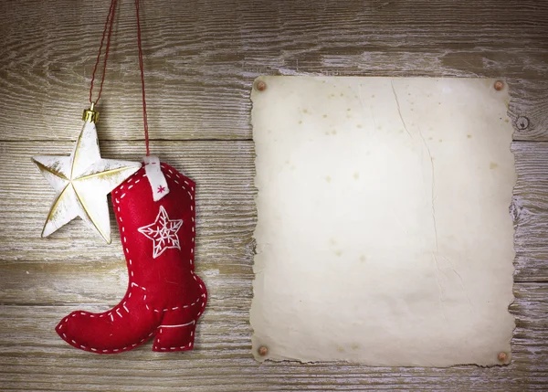 Cowboy christmas background with western toys boot and star on o — Stock Photo, Image