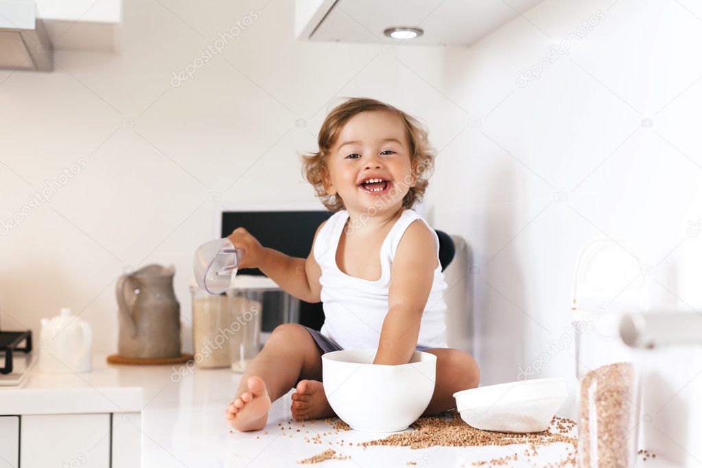 Toddler playing at the kitchen