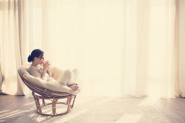 Woman relaxing in chair — Stock Photo, Image