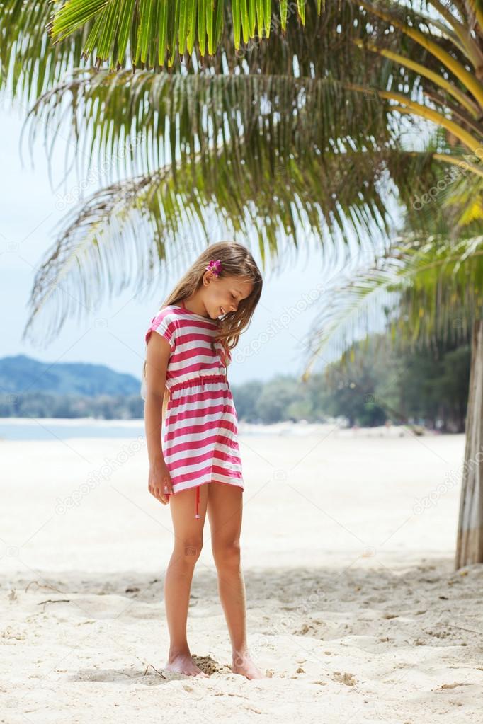 Kid girl on the beach