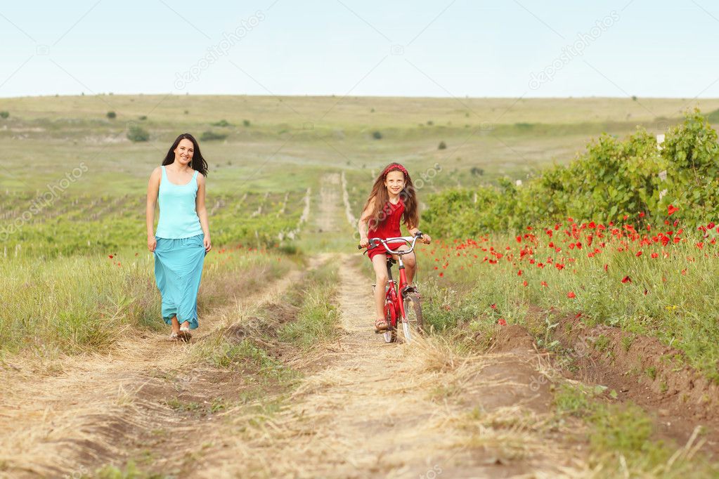 Mother with her child on bicycle