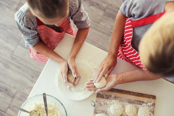 Mother and daughter are cooking