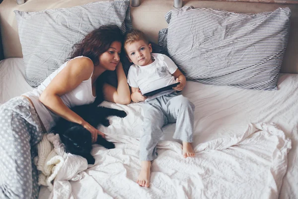 Mom relaxing with her little son