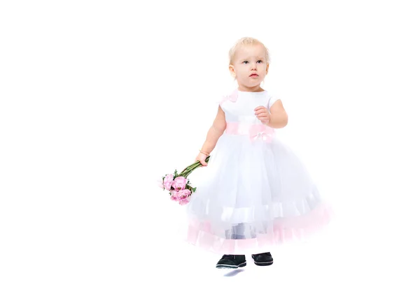 Beautiful little girl with flowers — Stock Photo, Image