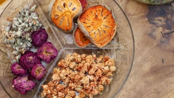 Dried flowers and fruits on a plate — Stock Video