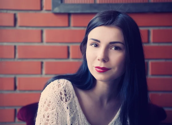 Young brunette girl in a cafe — 스톡 사진