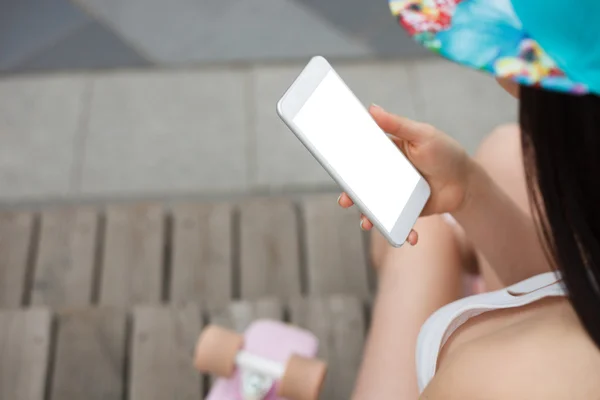 Girl using big modern phablet smartphone with blank screen — Stock Photo, Image