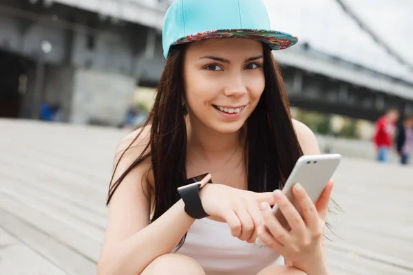 Girl using big modern phablet smartphone with dual camera — Stock Photo, Image
