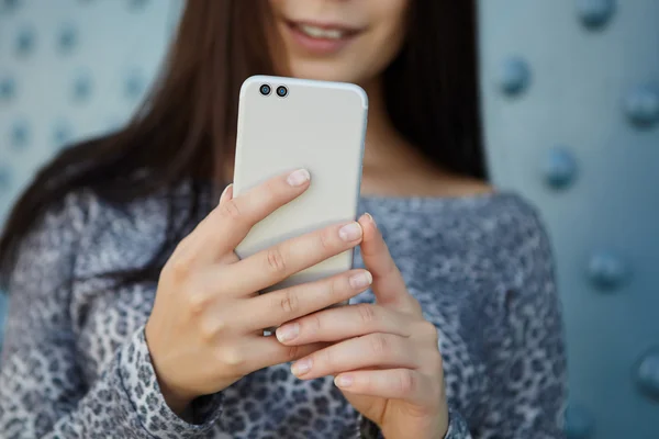 Girl taking photo with modern dual camera smart phone — Stock Photo, Image