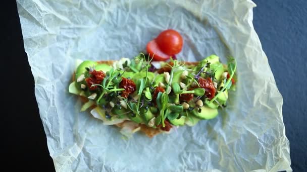 Avocado Toast Dry Tomatoes Filmed Zooming Out Video Clip Exotic — Stock Video