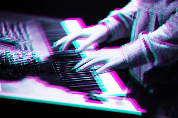 Pianist plays love set on concert in music hall.Professional piano player musician playing songs with midi synthesizer keyboard in night club.Edited with retro 3d stereo effect