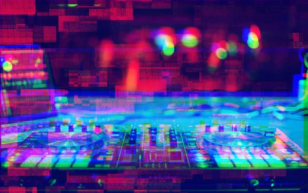 Professional dj midi controller on nightclub stage edited with vintage glitch effect.Digital turntable for disc jockey in the club.Stage audio equipment for concert.Mix music on entertainment event