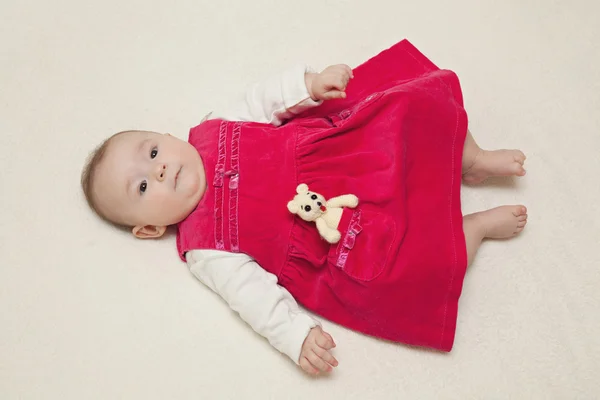 Baby girl inred velvet dress — Stock Photo, Image