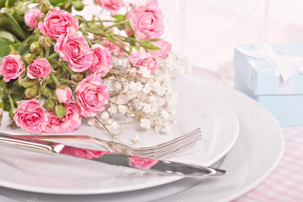 Spring table settings with fresh roses