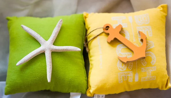 Holiday summertime travel concept - small toy pillows with starf — Stock Photo, Image