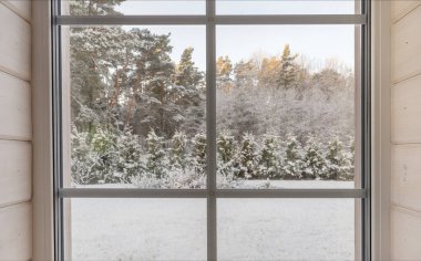 Home vinyl insulated windows with winter view of snowy trees and plants clipart