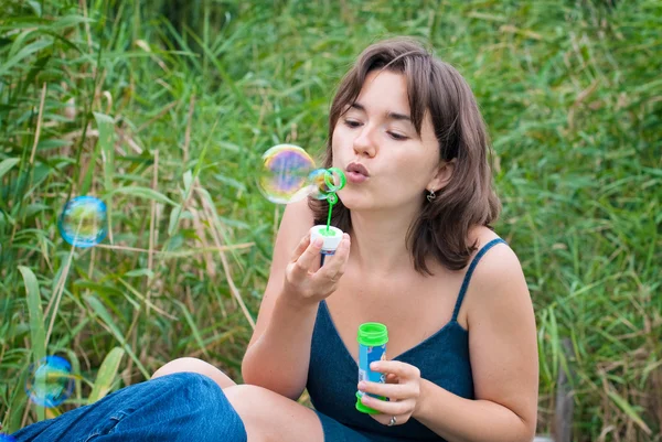 Young Woman Blows Soap Bubbles — Stock Photo, Image