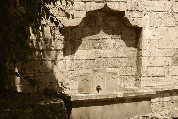 Water tap in a fortification wall.Kalemegdan. — Stock Photo, Image