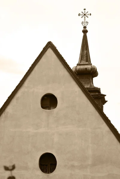 Roof of the old house and church spike. — Stock Photo, Image