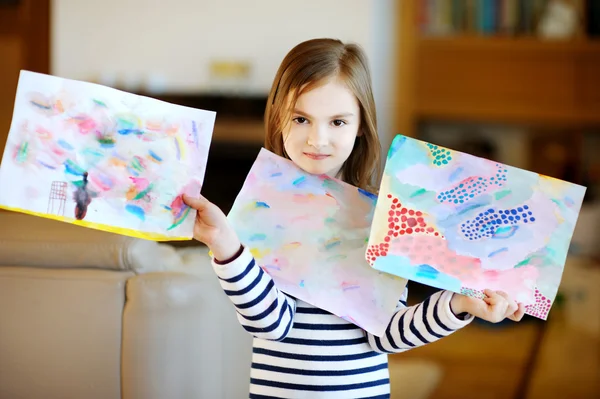 Girl showing her drawings — Stock Photo, Image