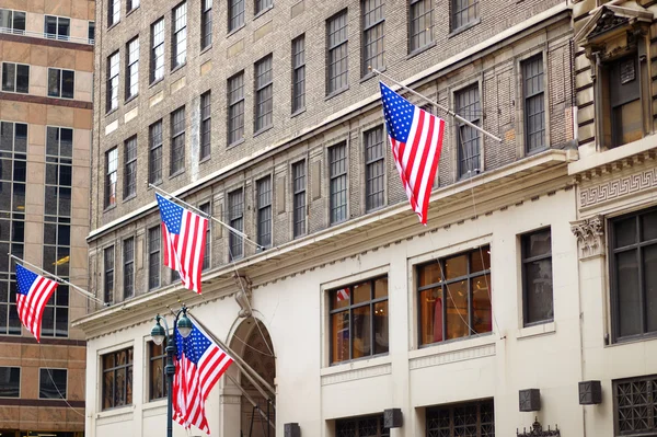 Flags of the United States on a skyscrapper — Stock Photo, Image