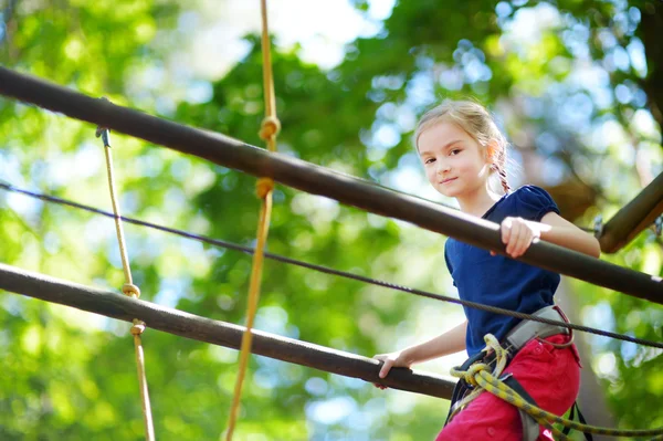 Little girl enjoying  climbing — Stock Photo, Image