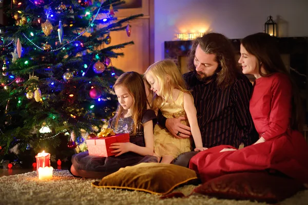 happy family by a fireplace
