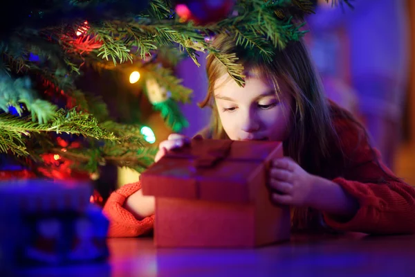 Little girl looking for gifts Stock Photo