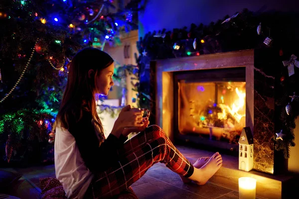 Happy Young Girl Having Cup Hot Chocolate Fireplace Cozy Dark — Stock Photo, Image