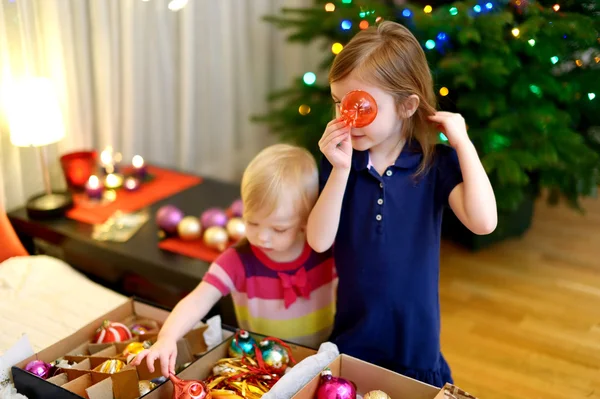 Sisters with decorations — Stock Photo, Image