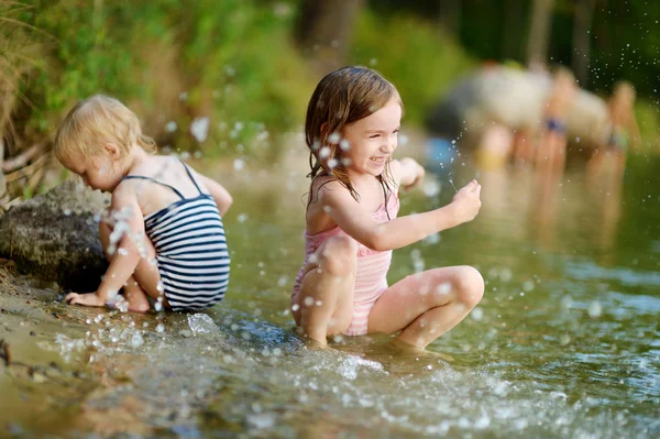 Sisters in summer river — Stock Photo, Image