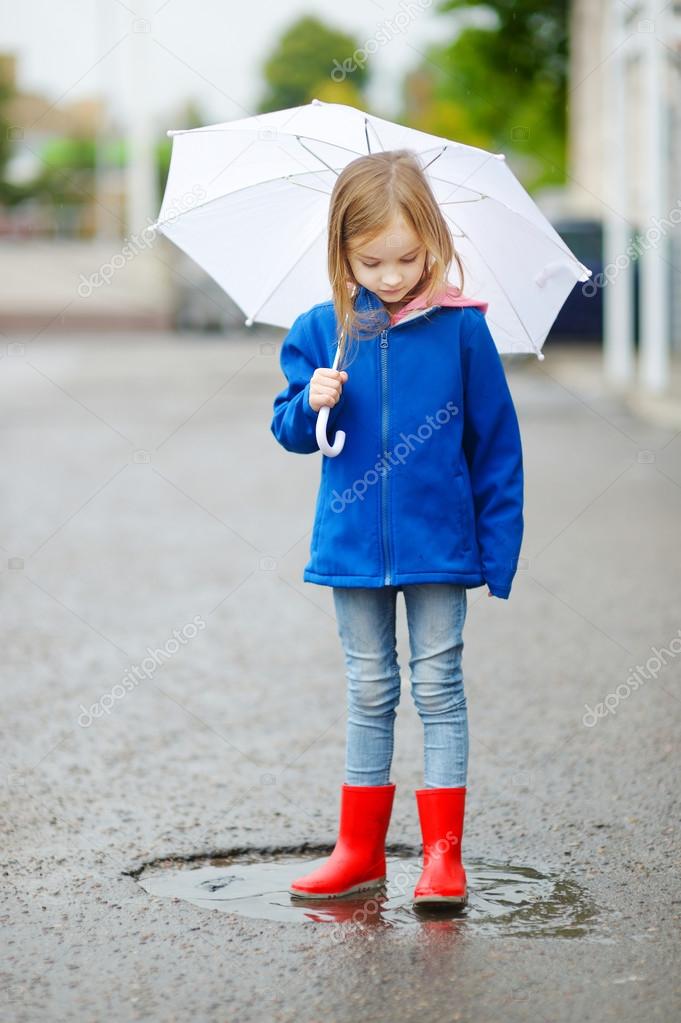 Adorable little girl with umbrella