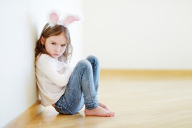 Angry little girl wearing bunny ears clipart