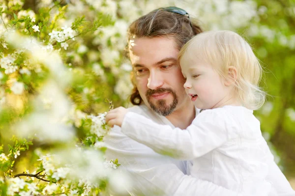 Father and daughter  blossoming garden — Stock Photo, Image