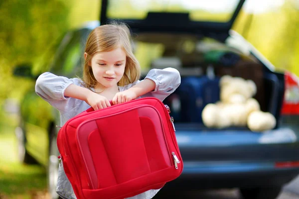 Adorable little girl with suitcase — Stock Photo, Image