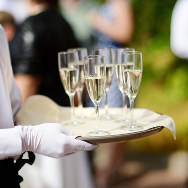 Waiter with tray of champagne clipart