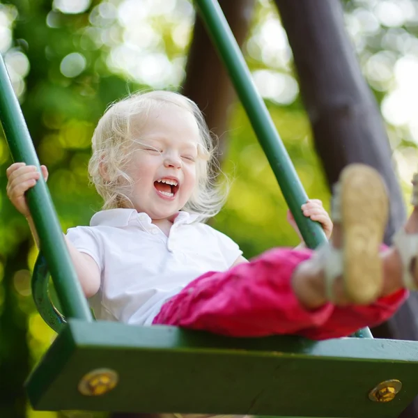 Girl having fun on swing — Stock Photo, Image