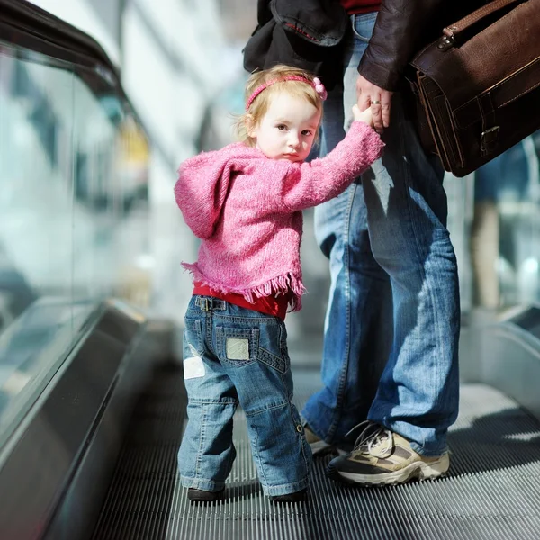 Toddler girl and father on escalator — Stock Photo, Image