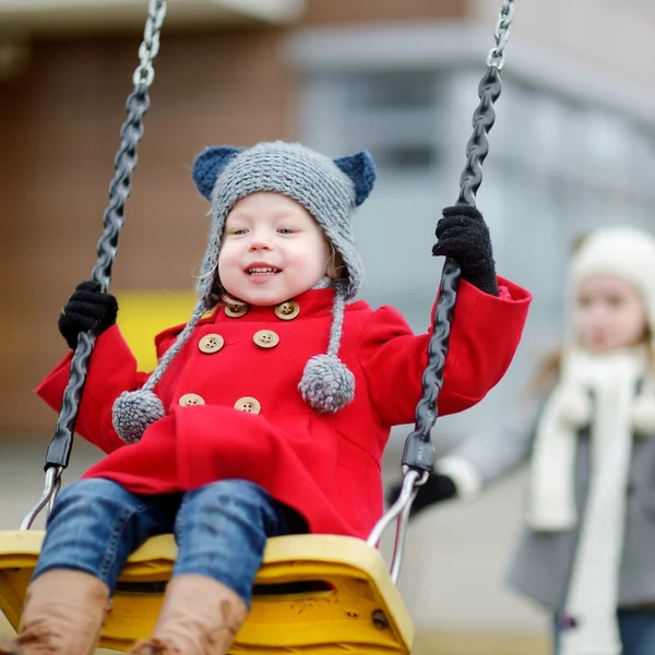 Little girl having fun on  swing — Stock Photo, Image