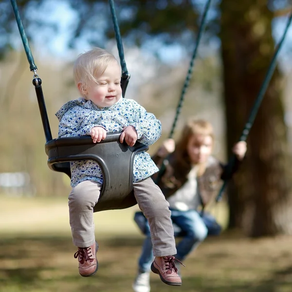 Swinging toddler girl — Stock Photo, Image