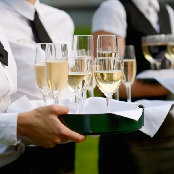 Waitress with tray of champagne — Stock Photo, Image