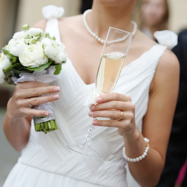 Bride with glass of champagne — Stock Photo, Image