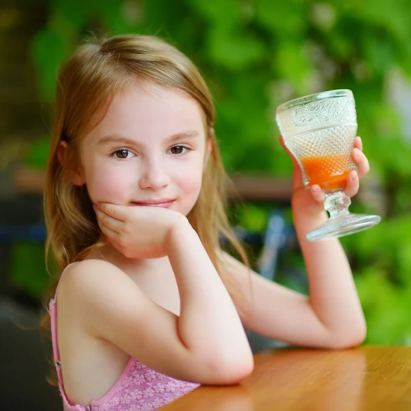Girl drinking juice Stock Photo by ©MNStudio 51870547