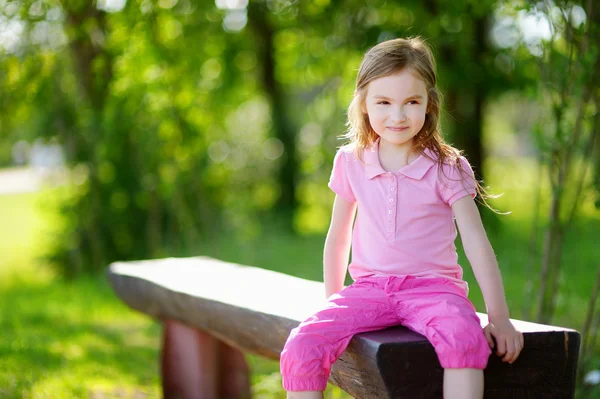 Little girl smiling outdoors — Stock Photo, Image