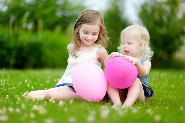 Cute little sisters having fun — Stock Photo, Image