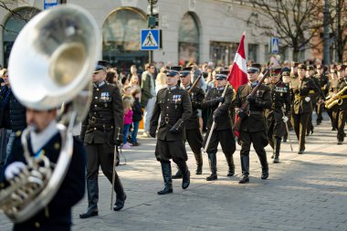 VILNIUS, LITHUANIA - MARCH 11, 2025: Festive parade as Lithuania marked the 35th anniversary of its independence restoration. Parade participants carrying national flags. Kovo 11.