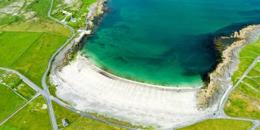 Aerial view of the wide sandy Kilmurvey Beach on Inishmore, the largest of the Aran Islands in Galway Bay, Ireland.